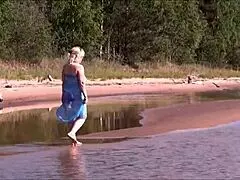 Pretty blonde milf masturbates on beach