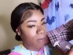 this hot ebony baddie is sucking on a big black cock, deepthroating it while feeling emotional.