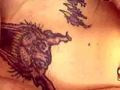 Detailed View Of An Inked Blonde Milf