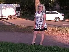 I caught a sexy milf upskirt on the street showing her cute dress and bare pussy