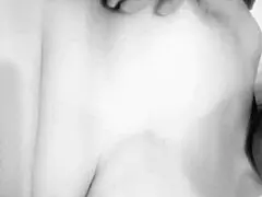 this busty milf is caressing her big tits at home