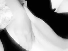 this busty milf is caressing her big tits at home