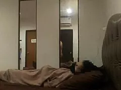 a mature woman in black nylon stockings posing elegantly.