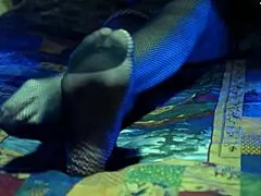 Perfect toes peek through sexy fishnets on a milf housewife