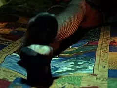 Perfect toes peek through sexy fishnets on a milf housewife