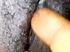 Ebony girlfriend touches vagina sensually on bed