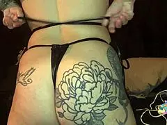 beautiful brunette milf in leather bikini with interracial couple.