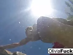 olivia splashes around in the pool with a big smile 😊