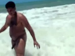 filming an alpha stud pounding and finishing on a public beach