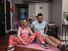 stepmom in pretzel pose yoga with face sitting