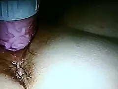 Blindfolded wife using rabbit toy