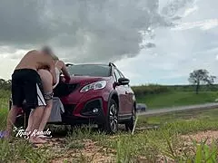 couple enjoys outdoor moment with passing cars
