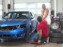 Dame with big boobs licks anus at car repair shop