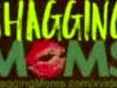 two busty women at a desk in a close-up scene