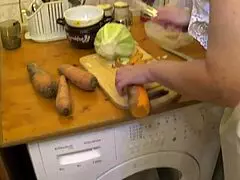 A detailed narrative on preparing a carrot for cooking.