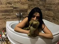 Preview of MilfyCalla Peeing in Bathtub with Fur Coat and Tight Pantyhose On.