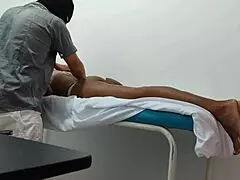 the doctor gives special attention and sensual massage to his female patient