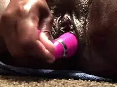 Check out this beautiful ebony milf's pussy squirting closeup with dildo