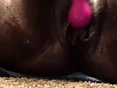 Check out this beautiful ebony milf's pussy squirting closeup with dildo