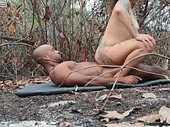 The sexy brunette was caught giving it to the neighbor in the woods