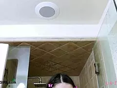 Brunette model enjoys a relaxing shower on the sofa