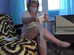This plump mature nurse shows off sexual therapy with toys and cream