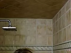 gorgeous blonde takes a relaxing shower on the sofa