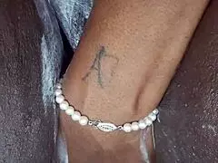 Black milf shaves her wet pussy with toys and tattoos on display