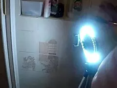 the brunette gives a blowjob to the blonde in the shower.