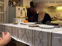 Husband jerking under table in front of step mom in kitchen
