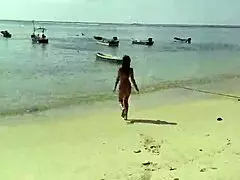 monika fox poses in pink bikini on beach