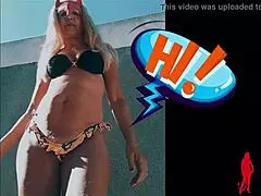 Come see this mature wife in bikini playing with her clit and natural tits.