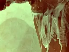 the stepsister is seen naked in the shower during her daily bathing routine at home