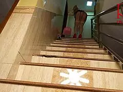 depraved maid regina noir cleans stairs in a large house while showing her tight juicy pussy