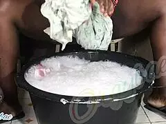 as a dedicated housewife, i tackle the weekend laundry routine, folding clothes neatly in our cozy home.