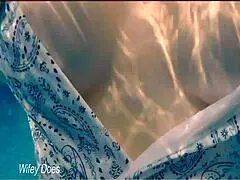 I watch my wife swim in the hotel pool.