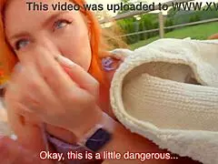 Risky public blowjob in the backyard where neighbors might catch the redhead couple swallowing.