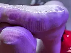 Hey, this goddess with big booty is teasing feet in white stockings on the red couch 😍