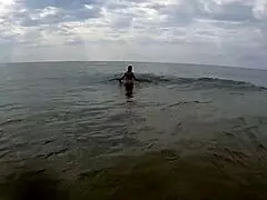 Busty Spanish girl says, 'Watch me fuck on the public beach.'