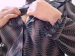 During office break, she plays with her big tits close up.