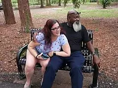nerdy milf strokes and sucks blk dick in the park