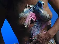 Girl gets messy with food on birthday cake