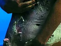 Girl gets messy with food on birthday cake