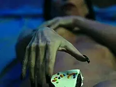 Girl gets messy with food on birthday cake