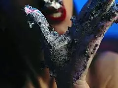 Girl gets messy with food on birthday cake