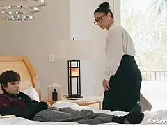 Teacher assists student with academic challenges in classroom