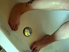 Washing dirty feet in the bathtub at home