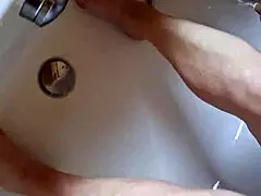 Washing dirty feet in the bathtub at home