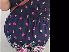 Following this mature woman in her skirt and thong on the street