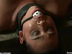 a busty lesbian gets shackled and flogged in rough bdsm play
